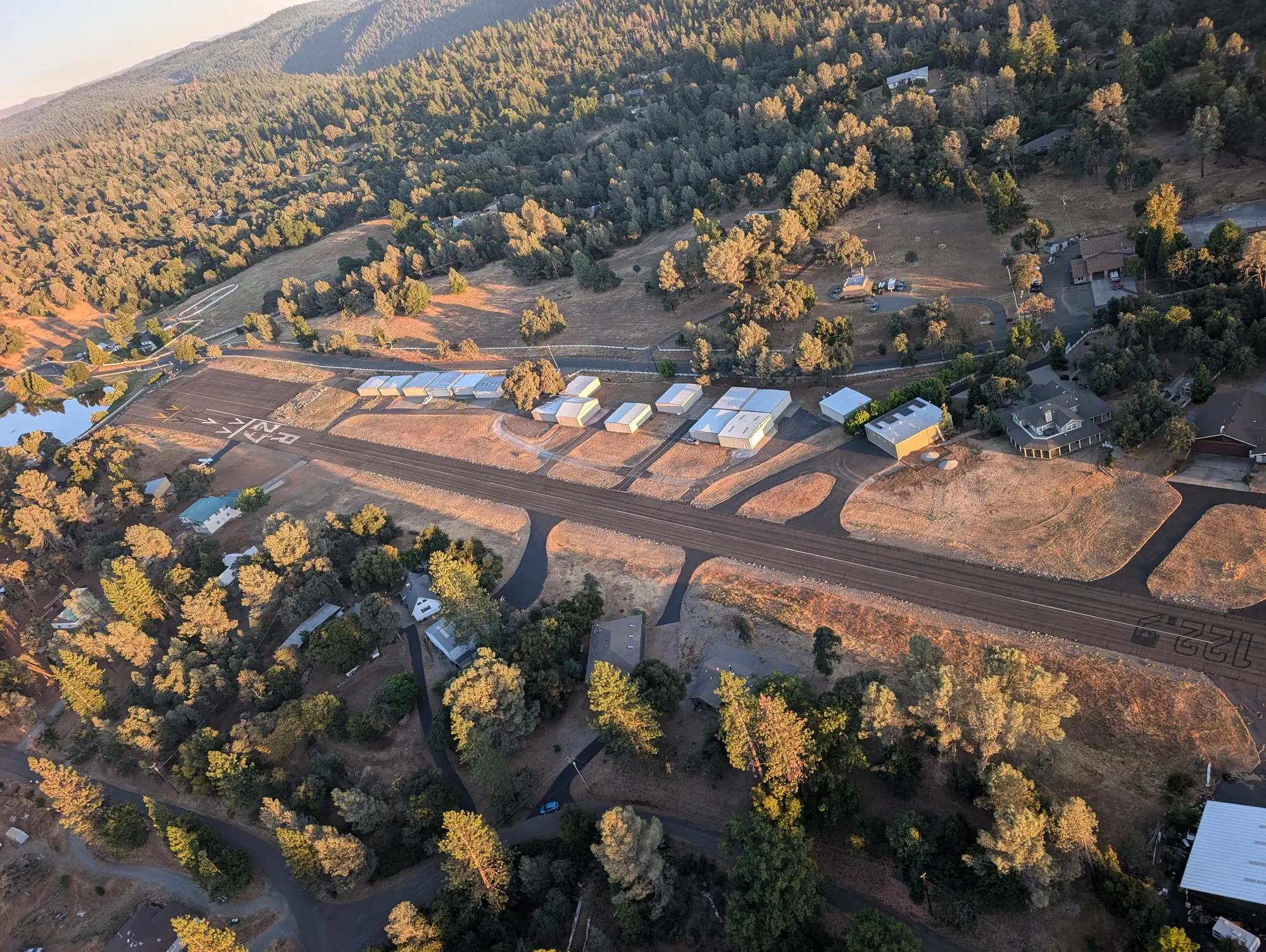 Aerial view of Swansboro Airport at golden hour
